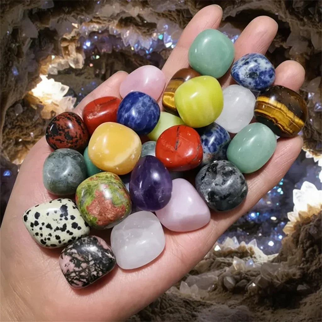 Assorted natural tumbled stones displayed in a geode for a magical, earthy aesthetic