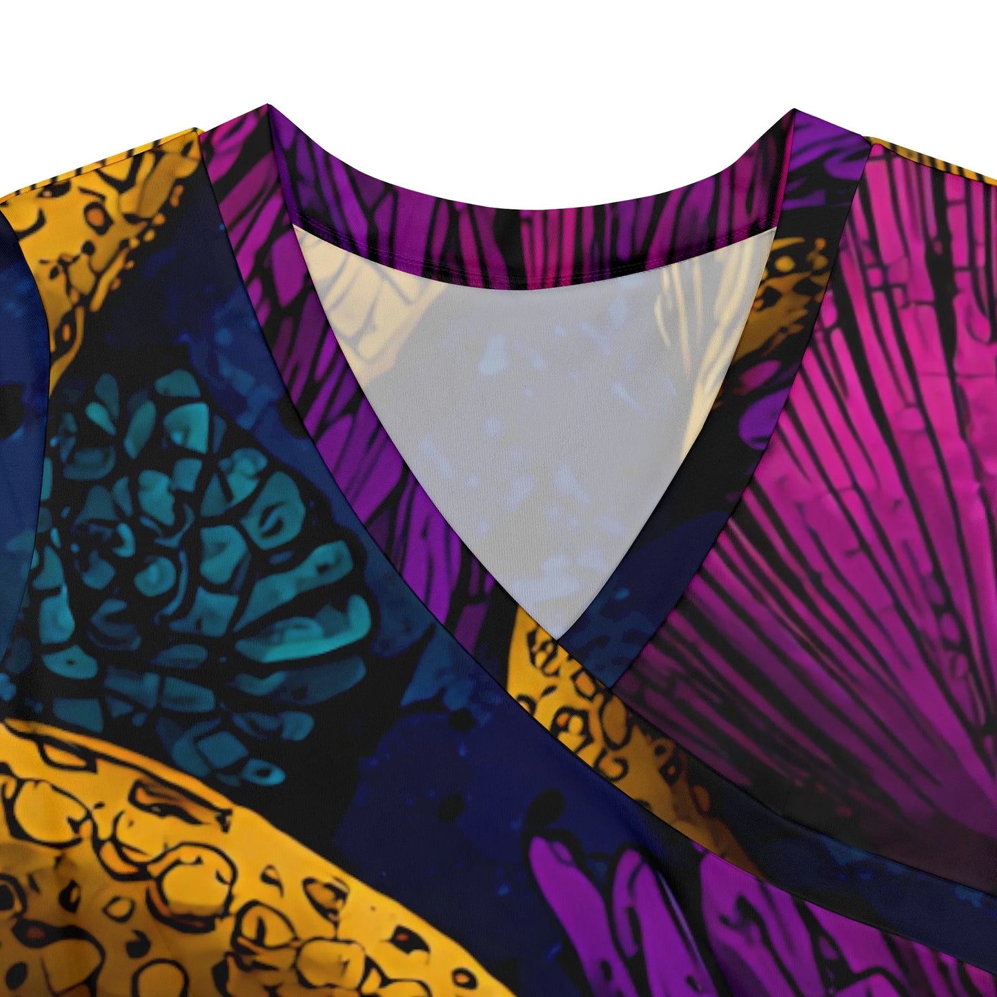 Close-up of the V-neck detail of the printed maxi dress, highlighting the knit fabric and color contrast.