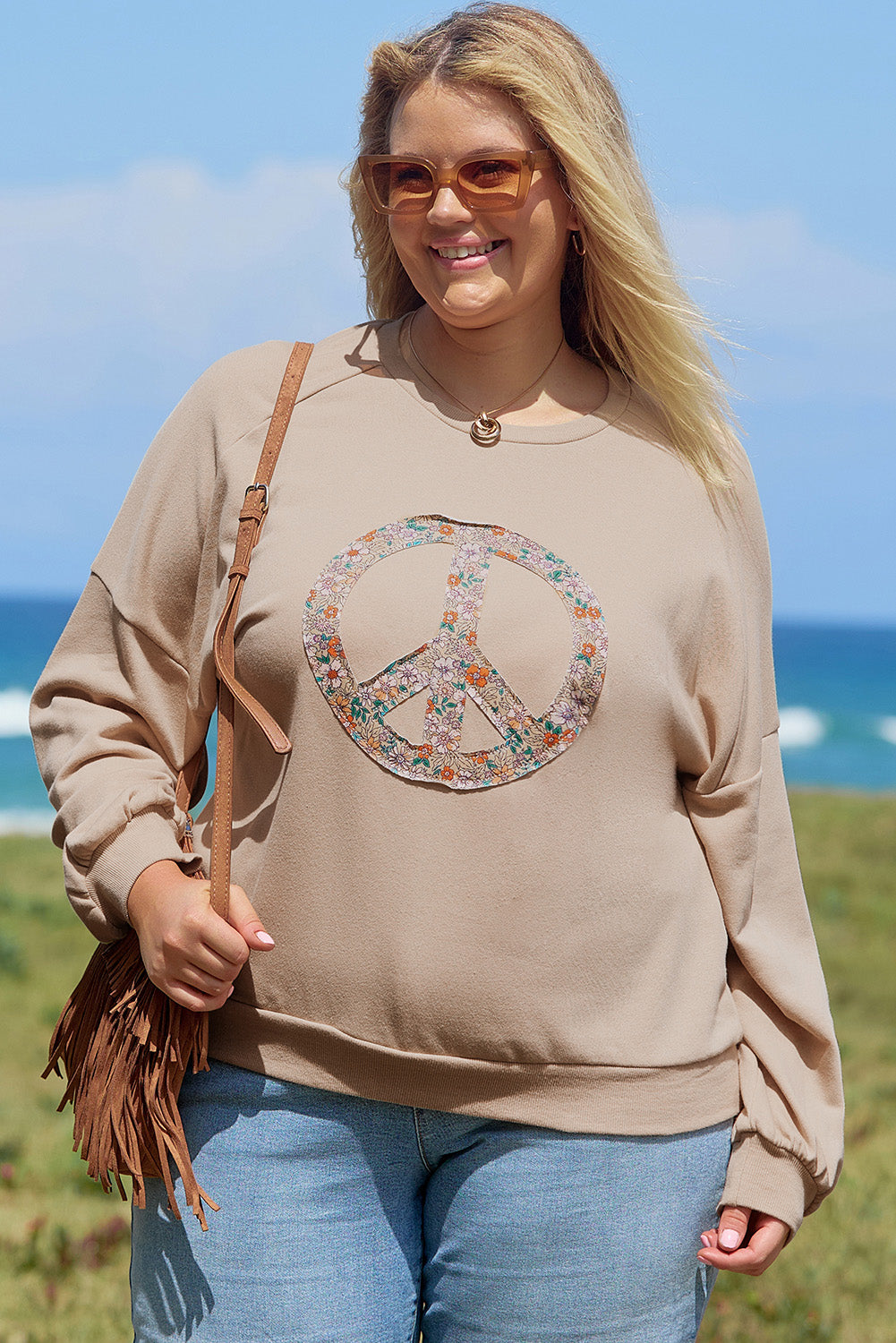 A pale khaki plus-size sweatshirt featuring a floral peace sign graphic and a Washed Terry Finish - ALOE WINGS STORE