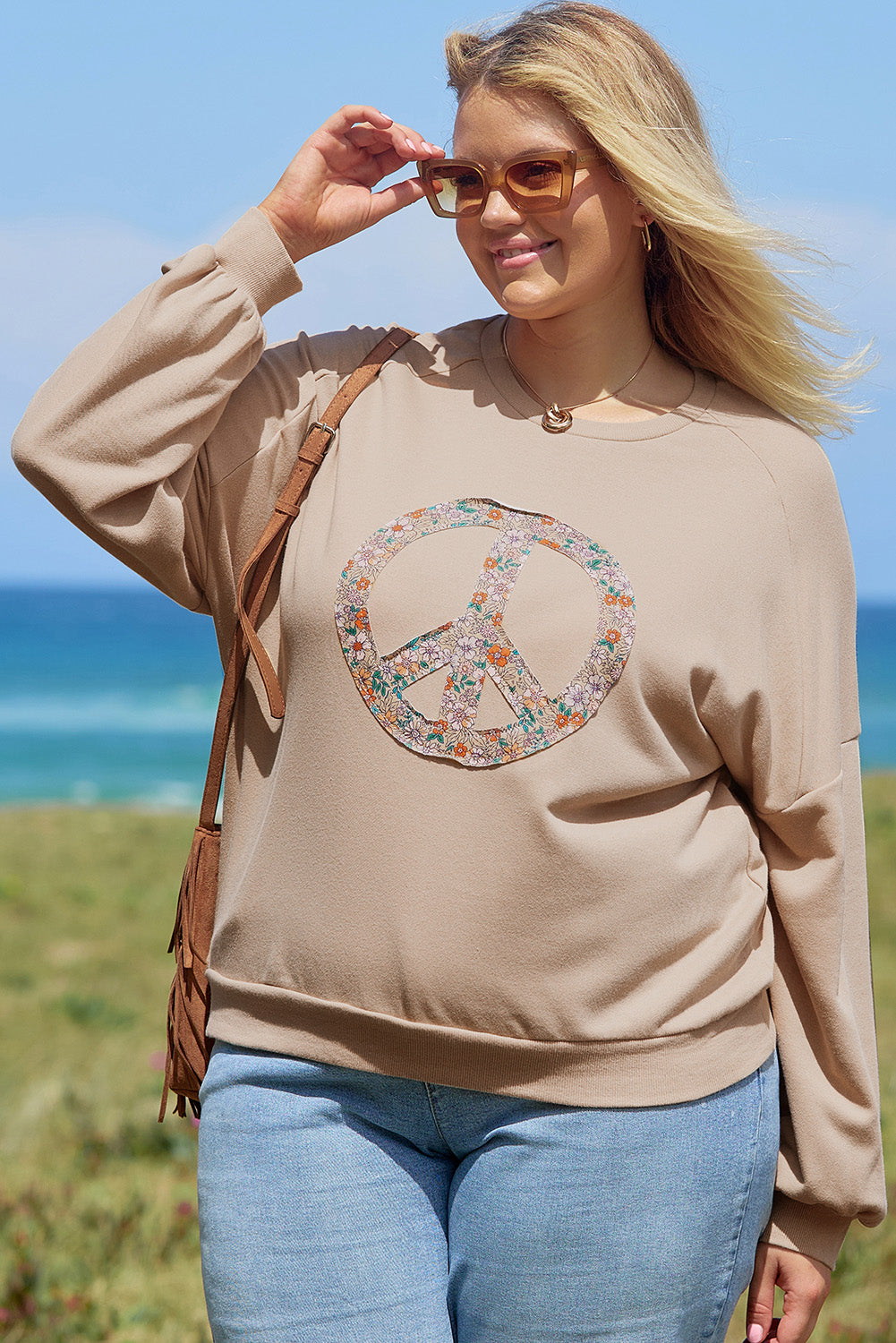 A pale khaki plus-size sweatshirt featuring a floral peace sign graphic and a Washed Terry Finish - ALOE WINGS STORE