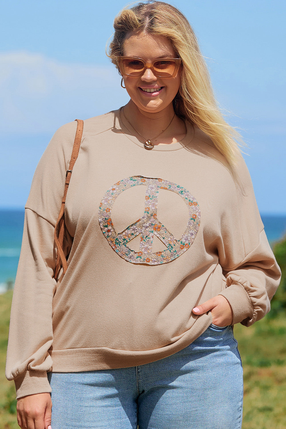 A pale khaki plus-size sweatshirt featuring a floral peace sign graphic and a Washed Terry Finish - ALOE WINGS STORE