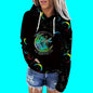 Black hoodie with colorful designs and text on a blue background