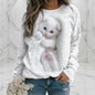 Minimalist white cat print sweatshirt with realistic 3D kitten, worn with jeans against marble backdrop