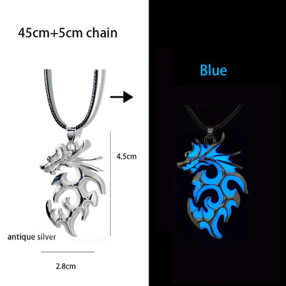 Dragon-shaped pendant necklace in antique silver and blue on a black background