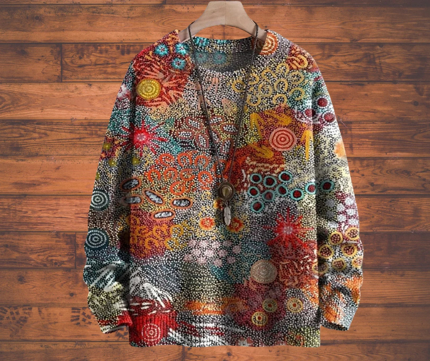 Colourful patterned jacket on a wooden hanger against a wooden background