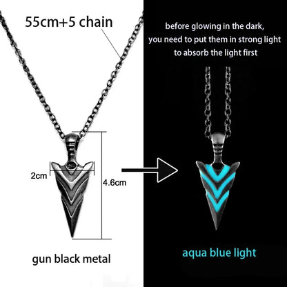 Glowing arrowhead pendant with chain, showing dimensions and light absorption instructions.
