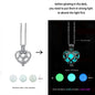 Glowing heart-shaped pendant with instructions on how to activate its glow.