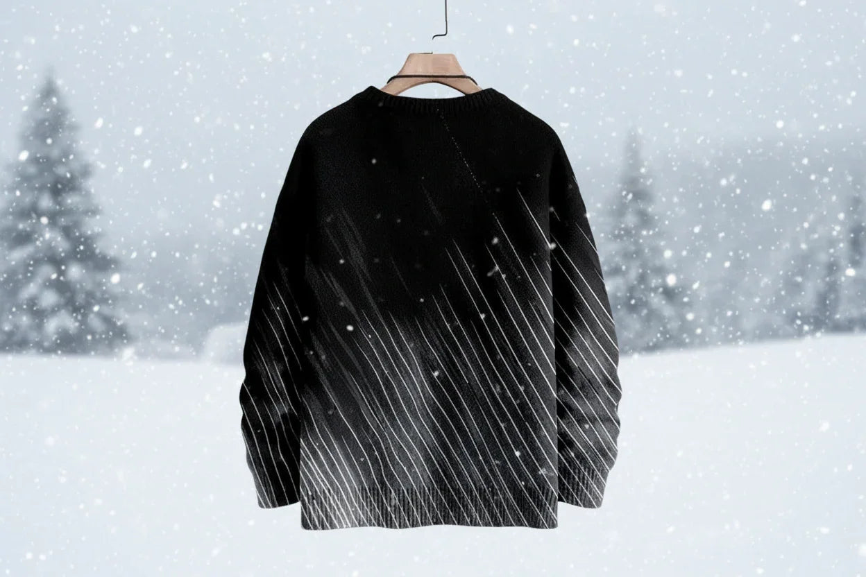 Black sweater on a hanger against a snowy background