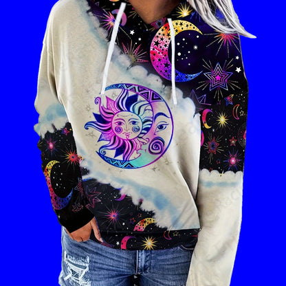 Hoodie with celestial design featuring sun and moon on a blue background
