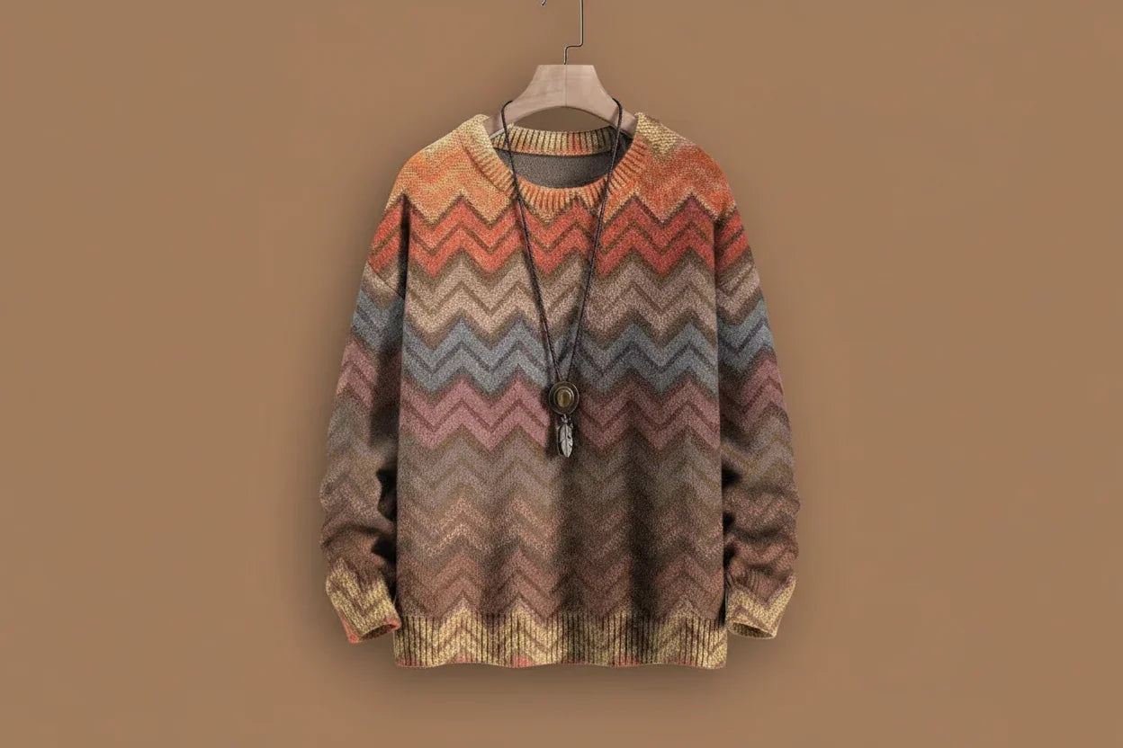 Multicolored zigzag patterned sweater on a hanger against a brown background
