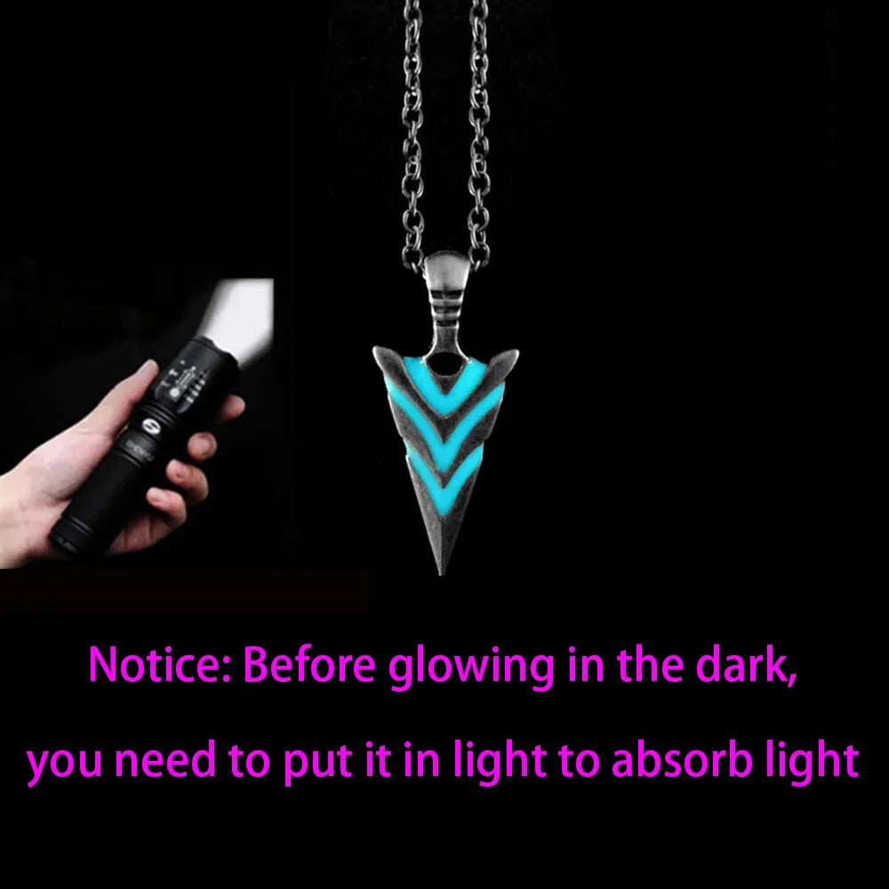 Necklace with arrowhead design glowing in dark after being exposed to light
