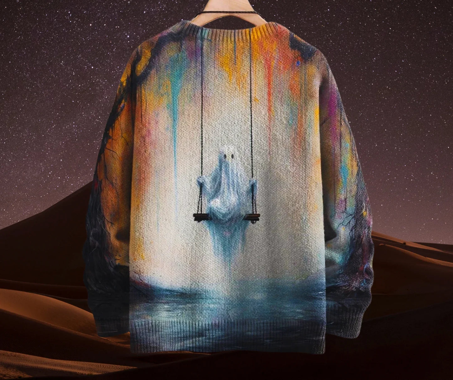Colourful sweater with a graphic of a person on a swing against a starry night sky.