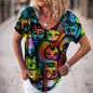  Vibrant t-shirt covered in a dense pattern of colorful, stylized cat faces.