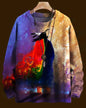 Colorful sweater with abstract design on a hanger against a dark background