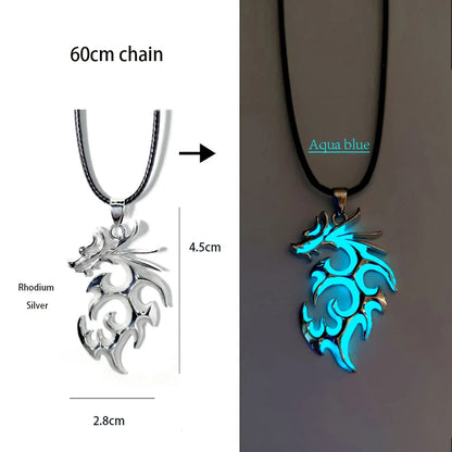 Two dragon-shaped pendants, one rhodium silver and the other aqua blue, on a chain.