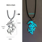 Two dragon-shaped pendants, one rhodium silver and the other aqua blue, on a chain.