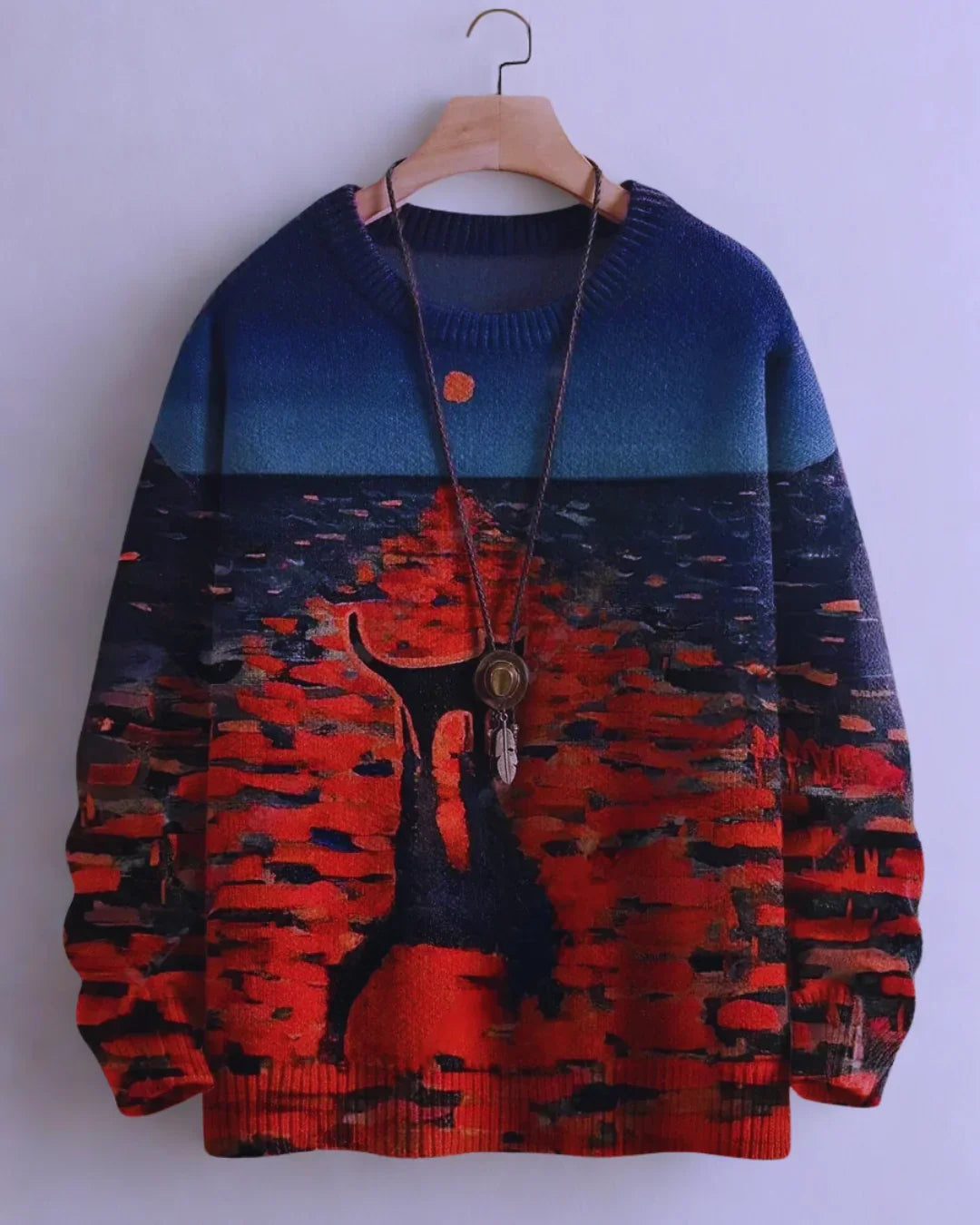 Silhouette of a black cat in a surreal red and blue landscape on a 3D sweater