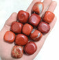 Stable red jasper tumbled stones for endurance and grounding