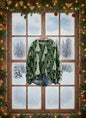 Green Christmas tree patterned sweater hanging by snowy window