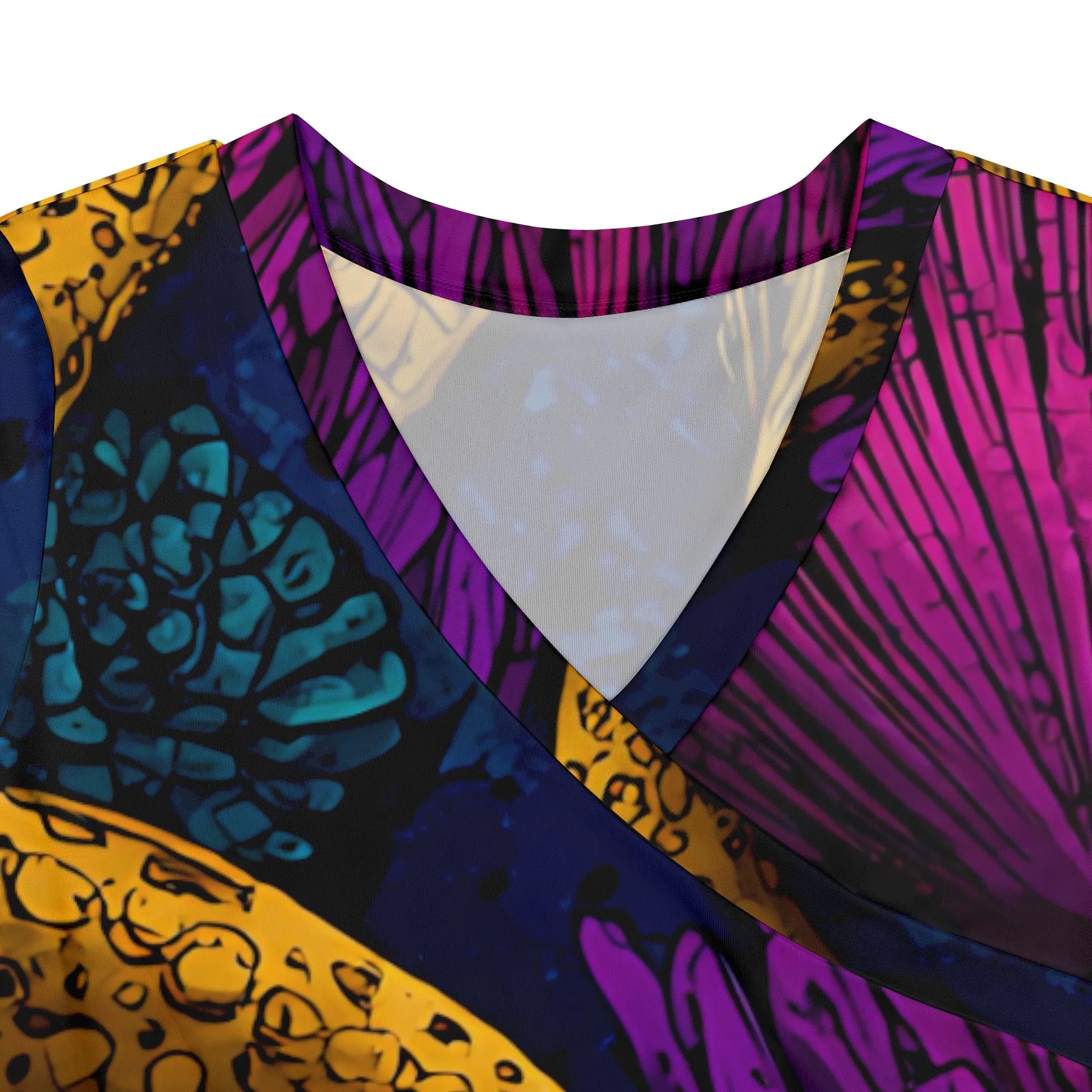 Close-up of the V-neck detail of the printed maxi dress, highlighting the knit fabric and color contrast.