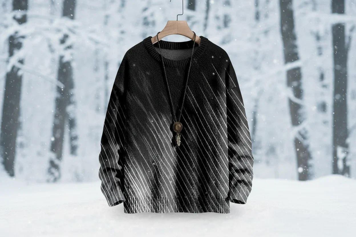 Black and white patterned sweater on a hanger against a snowy forest background
