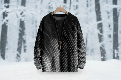 Black and white patterned sweater on a hanger against a snowy forest background