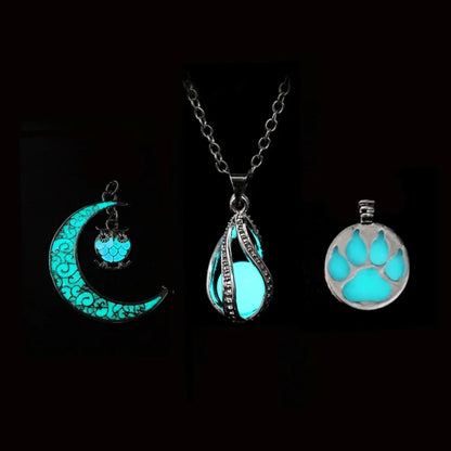 Three glowing pendants on a black background