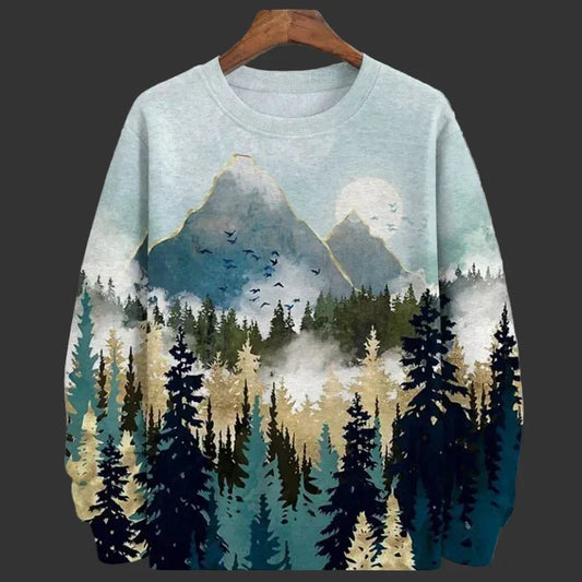 Sweatshirt with mountain and forest design on a hanger against a grid background