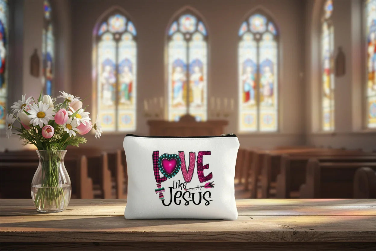 White pouch with 'Love Like Jesus' text and heart design on a white background