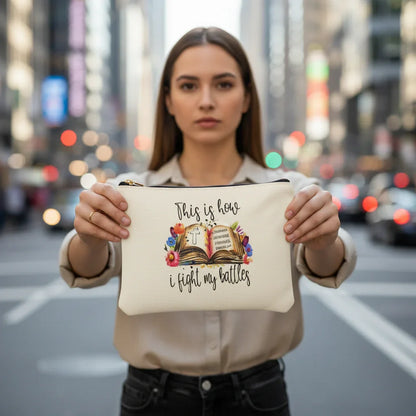 White pouch with motivational quote and floral design on a light background