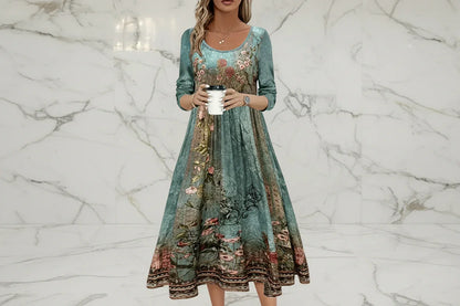 Woman wearing a long, floral embroidered dress holding a coffee cup.