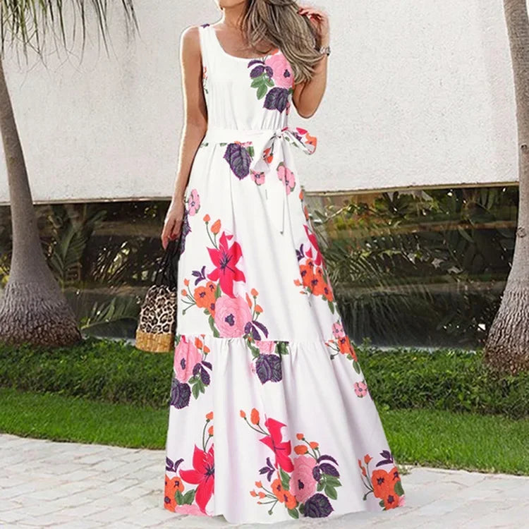 Woman wearing a white floral dress in an outdoor setting
