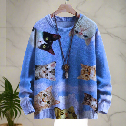 Light blue unisex sweater with a full-frontal collage of playful kittens and a unique cat head hood accent