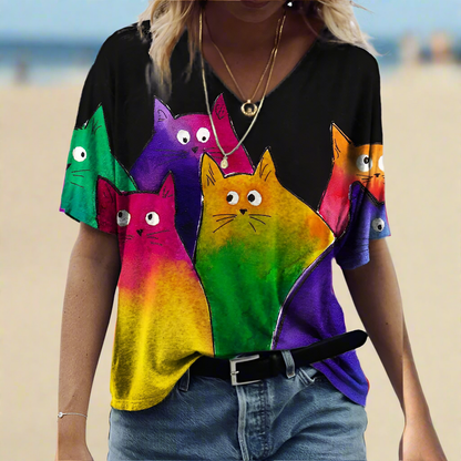  Black t-shirt with a vibrant, multi-colored pattern of five stylized cats in a row.