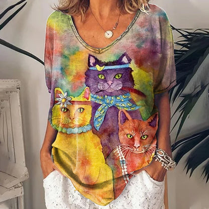 Soft, watercolor-style t-shirt with a group of three cats (purple, orange, yellow) in a cozy pose.
