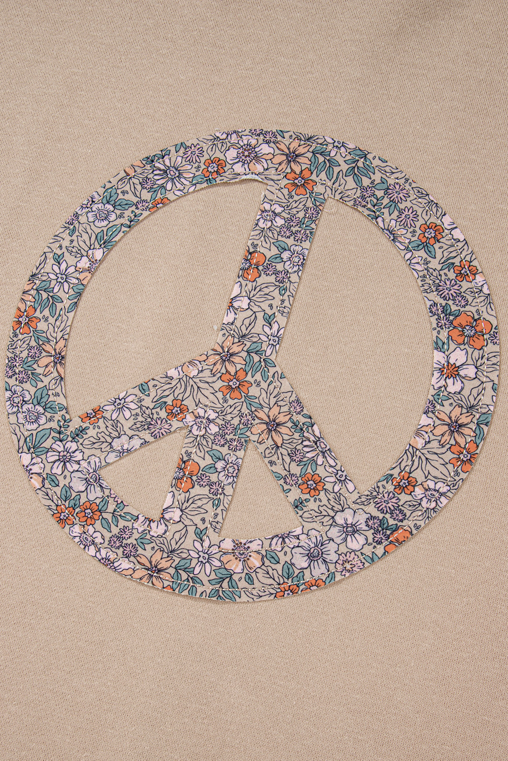 A pale khaki plus-size sweatshirt featuring a floral peace sign graphic and a Washed Terry Finish - ALOE WINGS STORE