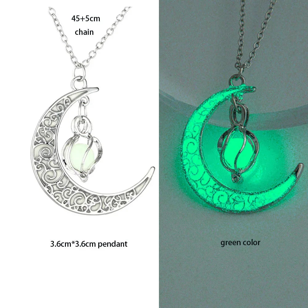 Crescent moon necklace with pendant glowing green on a gray background