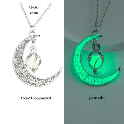 Crescent moon necklace with pendant glowing green on a gray background