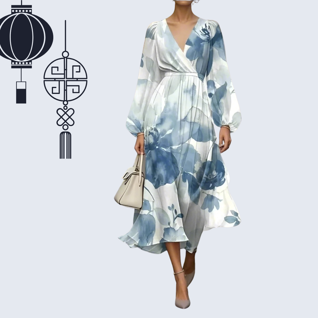 ​Women's patterned knee-length dress in soft pastel floral design