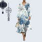 ​Women's patterned knee-length dress in soft pastel floral design