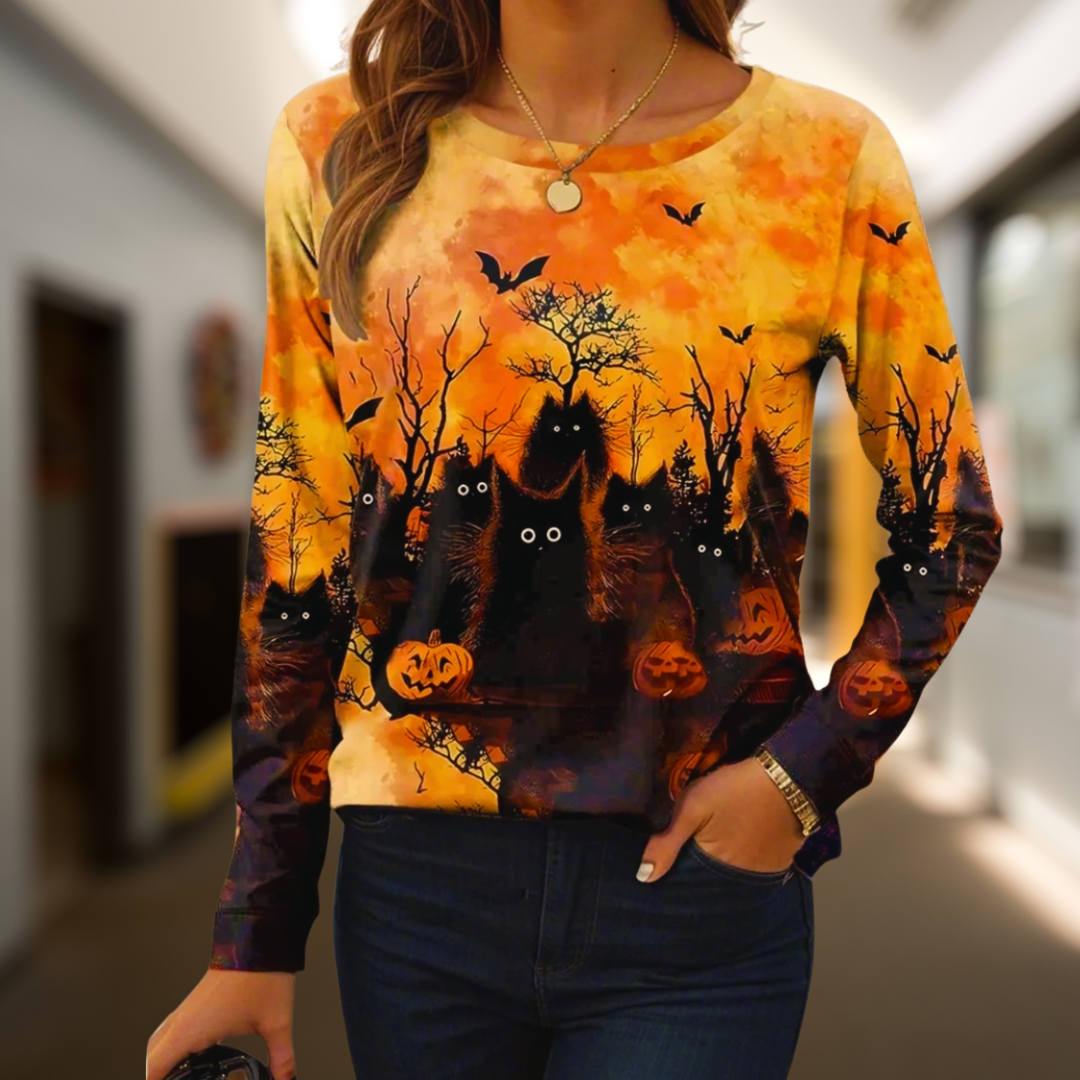 Orange long-sleeve sweater with black bats and smiling pumpkins at the bottom – playful Halloween theme.
