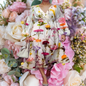 ​Green floral print knee-length dress with full sleeves, walking on a street