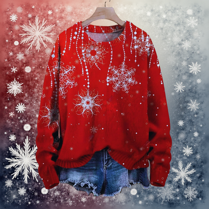 Red snowflake 3D sweater layered over denim jeans