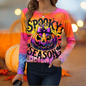 Orange gradient sweatshirt with haunted houses, pumpkins, and bats – detailed Halloween scene.
Sixth Image (Middle Center): Greenish-brown sweate