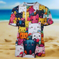 Beach scene with colorful cat face 3D print t-shirt on sandy shore, summer vibe