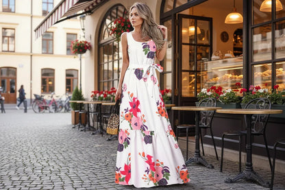 Woman wearing a floral dress with a blurred outdoor background